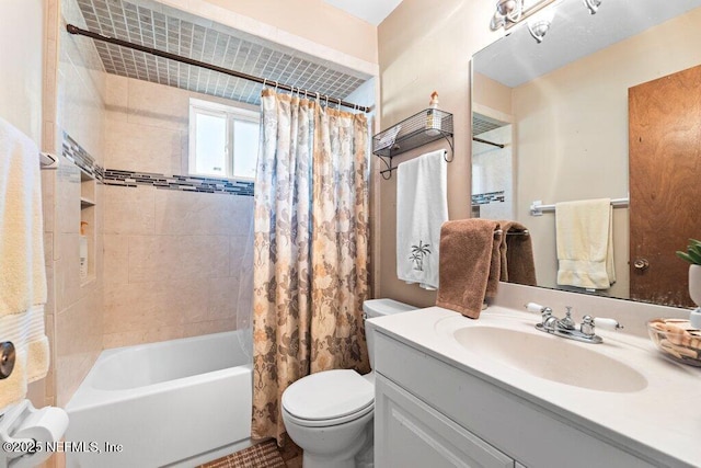 full bathroom featuring shower / tub combo with curtain, vanity, and toilet