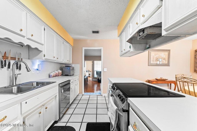 kitchen featuring stainless steel electric stove, black dishwasher, sink, white cabinets, and light tile patterned floors