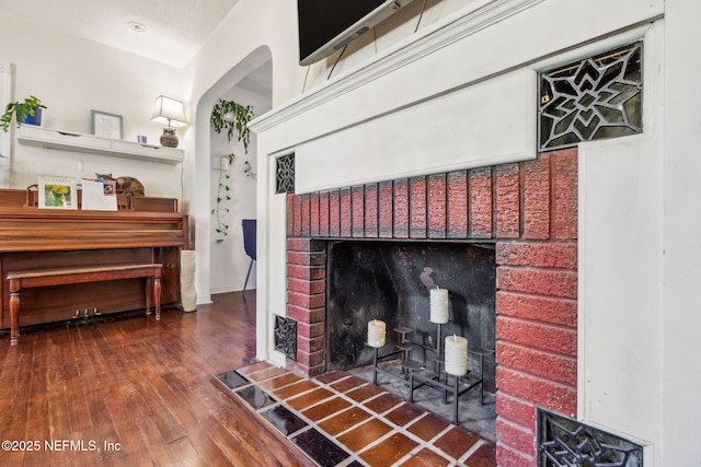 room details with a fireplace and wood-type flooring