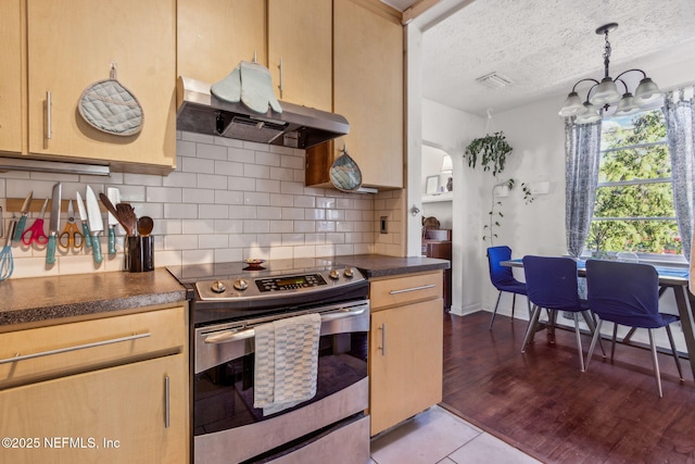 kitchen with light brown cabinetry, electric range, exhaust hood, and decorative backsplash