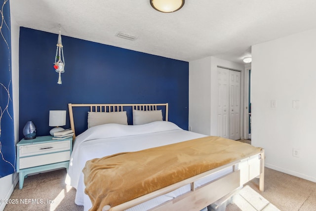 bedroom with a closet and carpet flooring