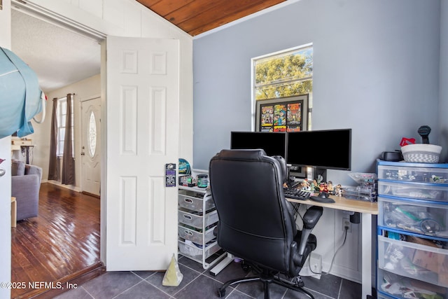 tiled office space featuring wood ceiling, lofted ceiling, and plenty of natural light