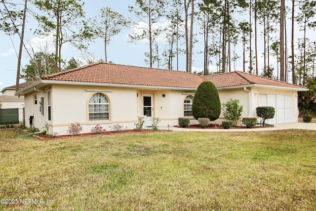 view of front of property with a garage and a front yard