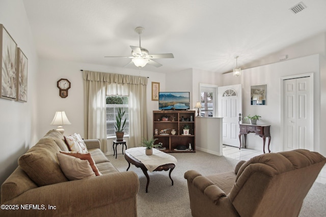 carpeted living room featuring ceiling fan