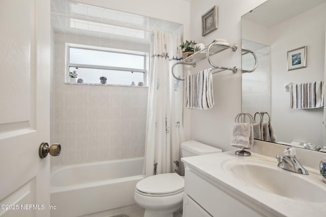 full bathroom with vanity, shower / tub combo, and toilet