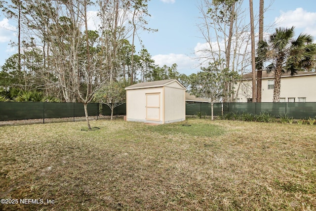 view of yard featuring a storage unit