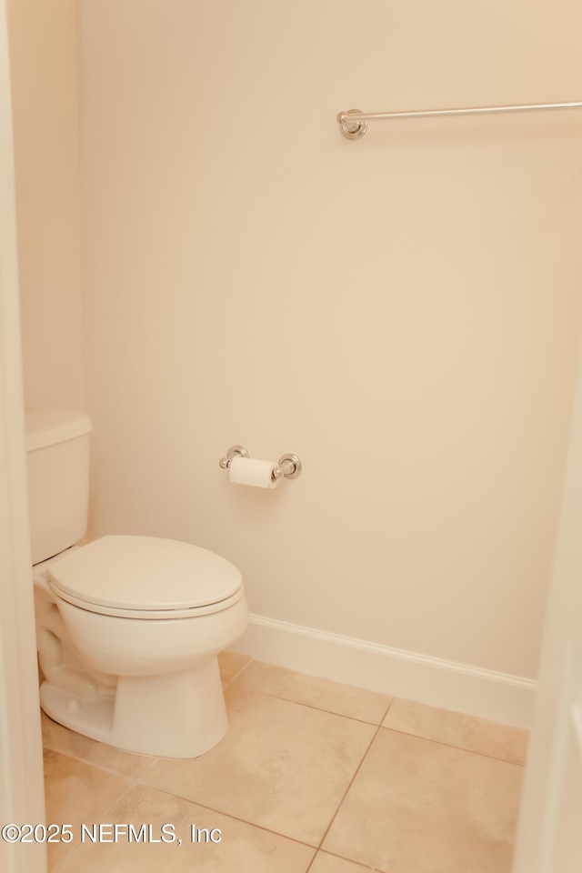 bathroom with tile patterned floors and toilet