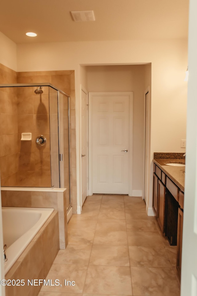 bathroom with vanity, tile patterned floors, and independent shower and bath