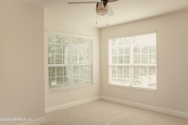 carpeted empty room with ceiling fan