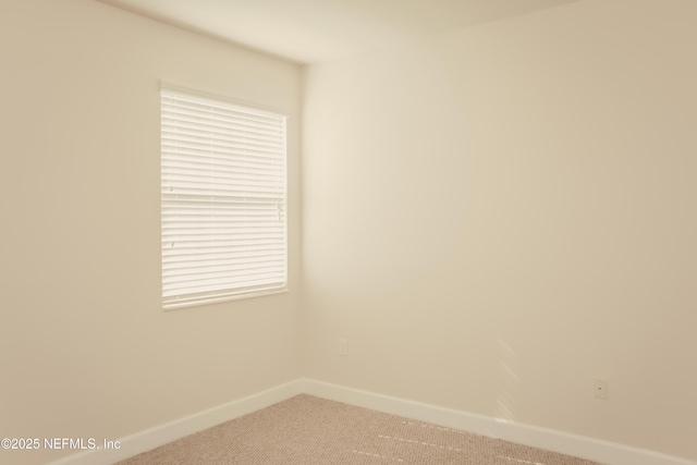 spare room featuring carpet flooring