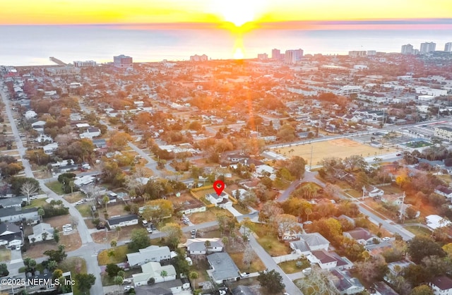 aerial view at dusk with a water view