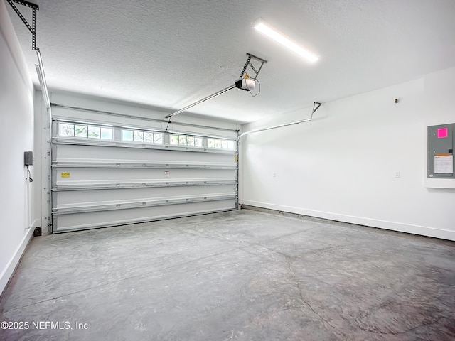 garage featuring a garage door opener and electric panel