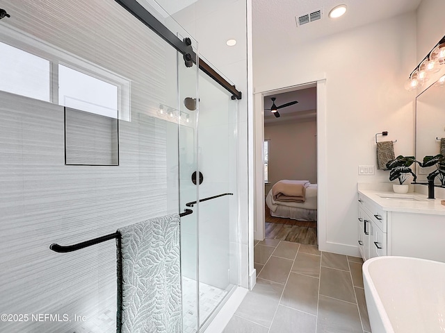 bathroom with tile patterned floors, vanity, and plus walk in shower