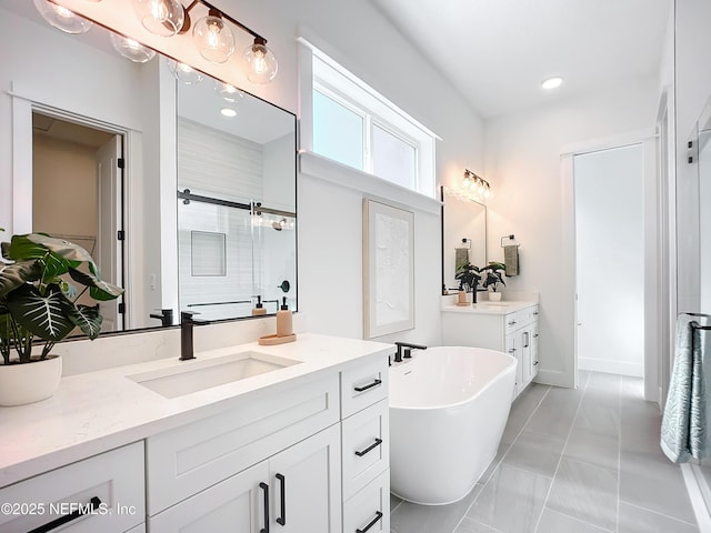 bathroom featuring vanity and separate shower and tub