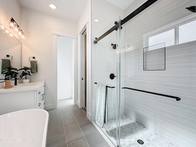 bathroom with vanity and independent shower and bath