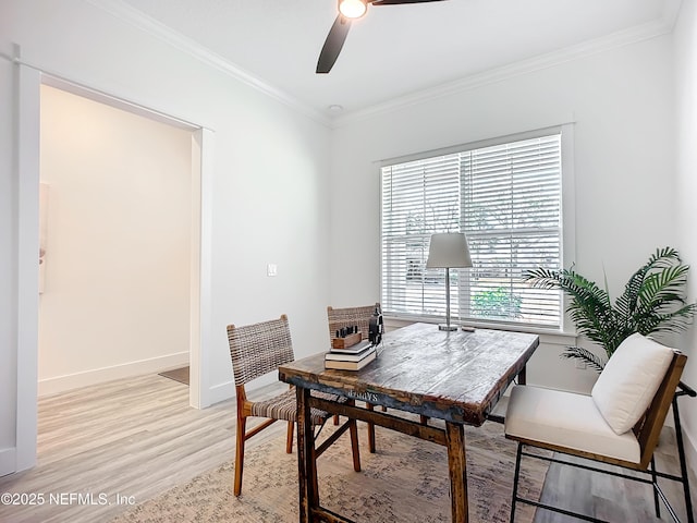 office space with ornamental molding, ceiling fan, and light wood-type flooring