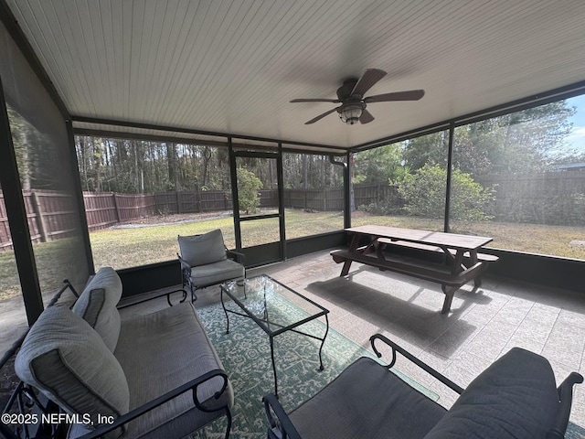 sunroom / solarium with ceiling fan