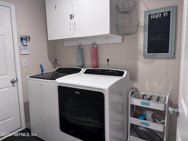 laundry room with cabinets and washer and dryer