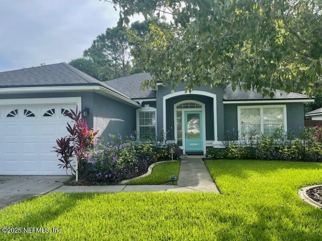 ranch-style home featuring a garage and a front lawn