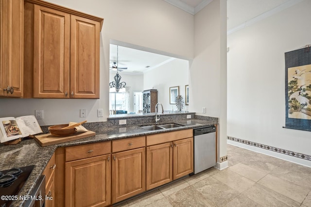 kitchen featuring dark stone countertops, sink, crown molding, and stainless steel dishwasher