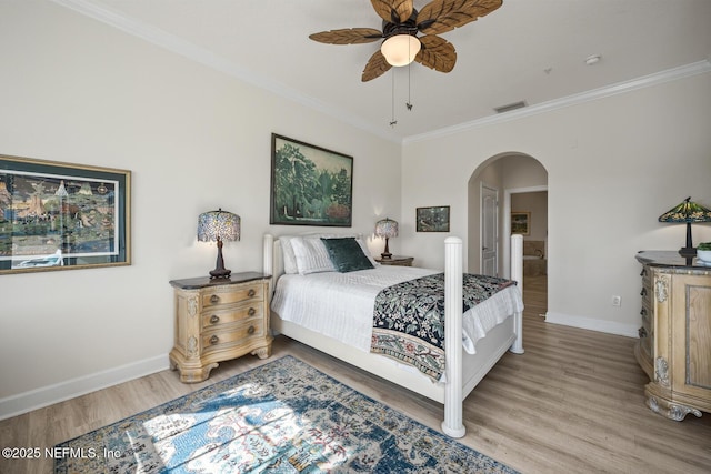 bedroom with ceiling fan, ornamental molding, and hardwood / wood-style floors