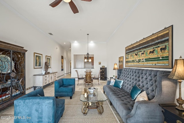 living room with light tile patterned flooring, ceiling fan, and ornamental molding