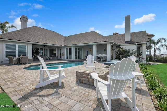 view of swimming pool featuring a patio area