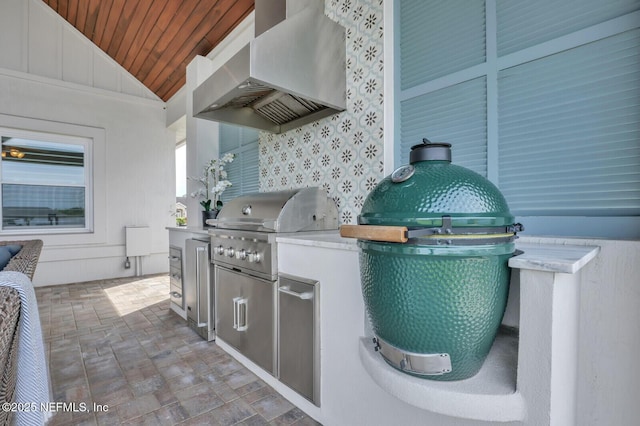 view of patio / terrace featuring a grill and exterior kitchen