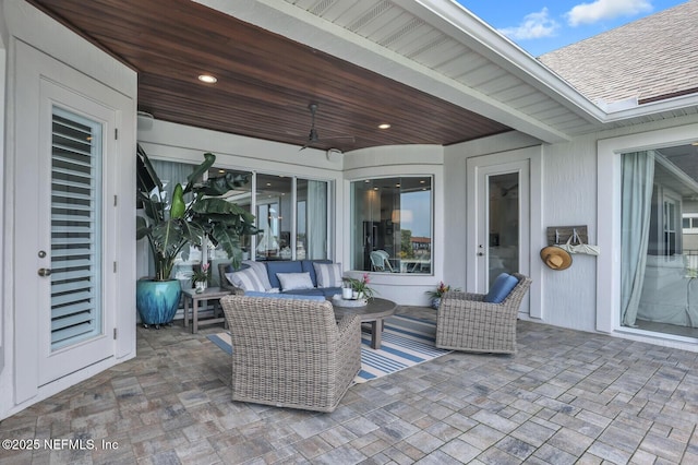 view of patio with ceiling fan and outdoor lounge area