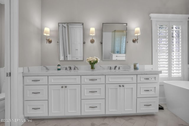 bathroom featuring vanity and a tub to relax in