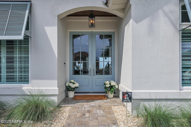 doorway to property featuring french doors