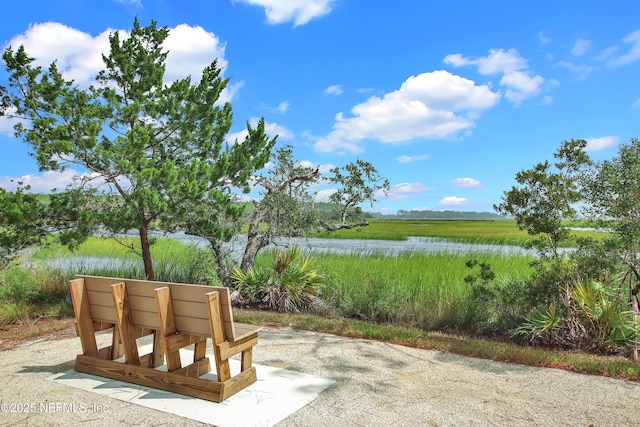 view of patio featuring a water view