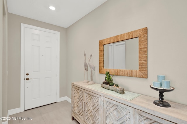 entryway featuring light tile patterned flooring