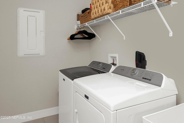 laundry room with tile patterned floors and washer and dryer