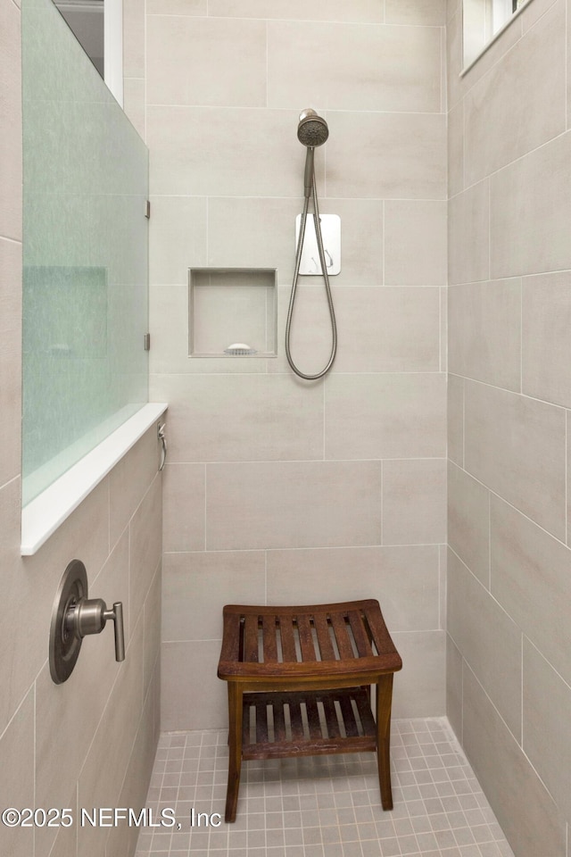 bathroom featuring tiled shower