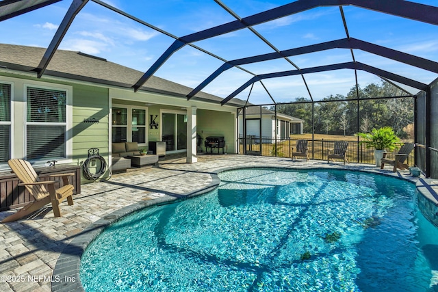 view of pool featuring a lanai, an outdoor hangout area, grilling area, and a patio area