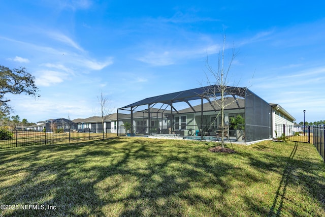 view of yard with glass enclosure