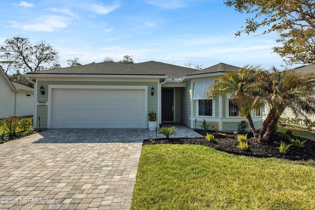 single story home featuring a garage and a front yard