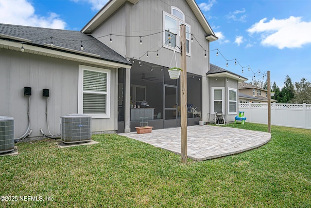 rear view of property with ceiling fan, a lawn, a patio, and central air condition unit