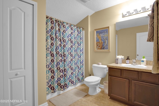 bathroom featuring vanity, a textured ceiling, vaulted ceiling, tile patterned floors, and toilet