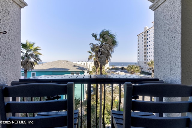 balcony featuring a water view