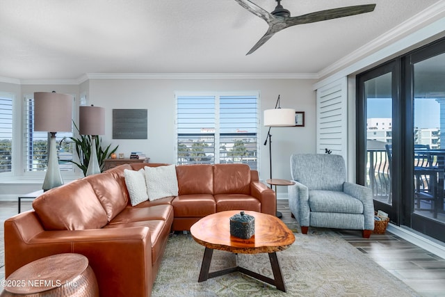 living room with crown molding, ceiling fan, and hardwood / wood-style floors