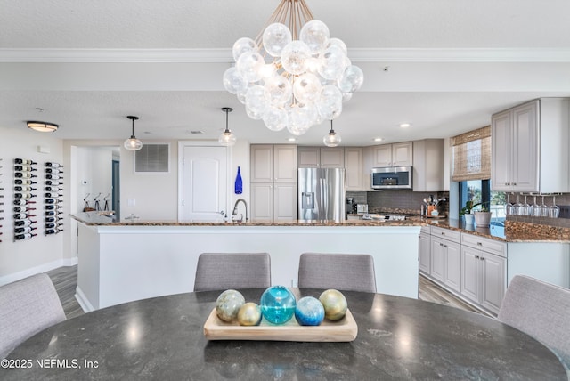 dining area featuring hardwood / wood-style flooring, ornamental molding, and a textured ceiling