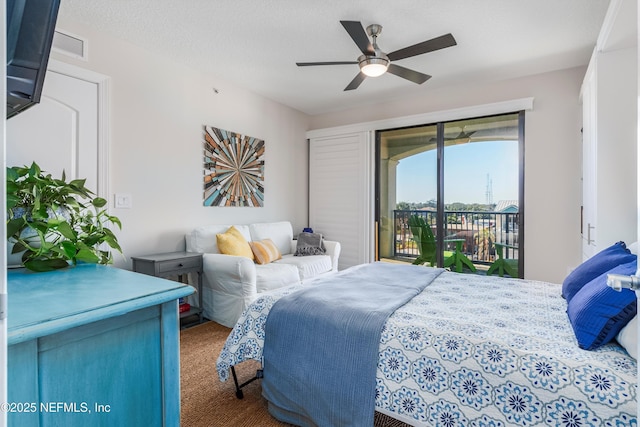 bedroom featuring ceiling fan, carpet, access to outside, and a textured ceiling