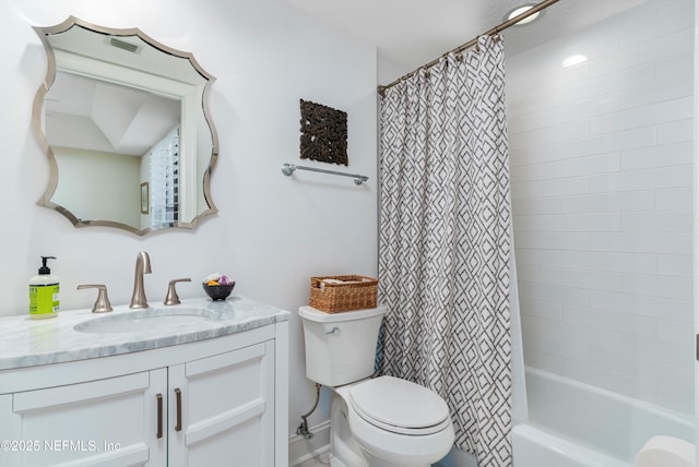 full bathroom with shower / tub combo with curtain, vanity, and toilet