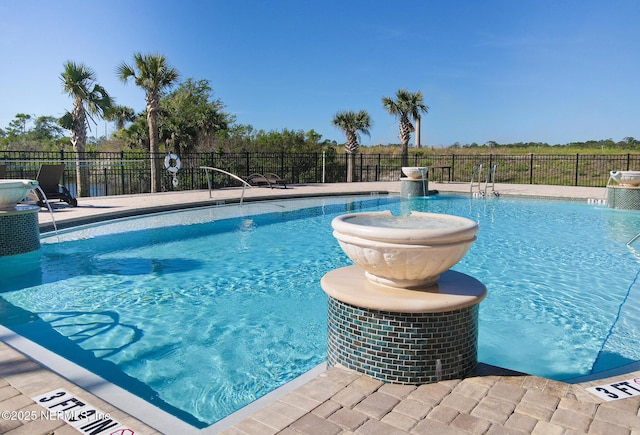 view of pool featuring pool water feature