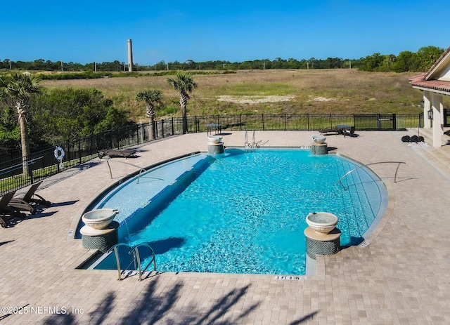 view of swimming pool featuring a patio