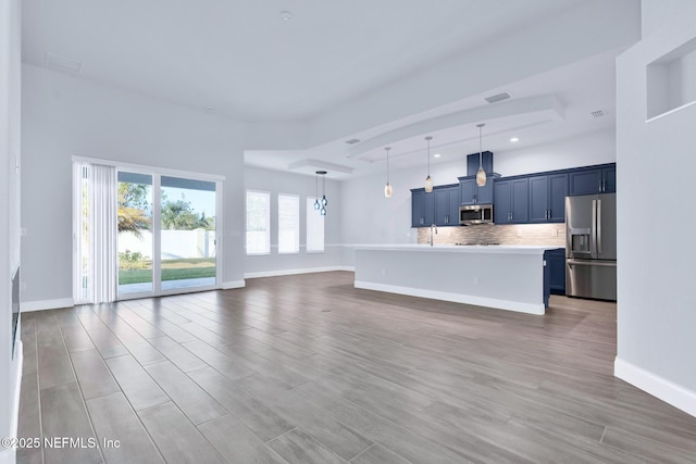 unfurnished living room with sink