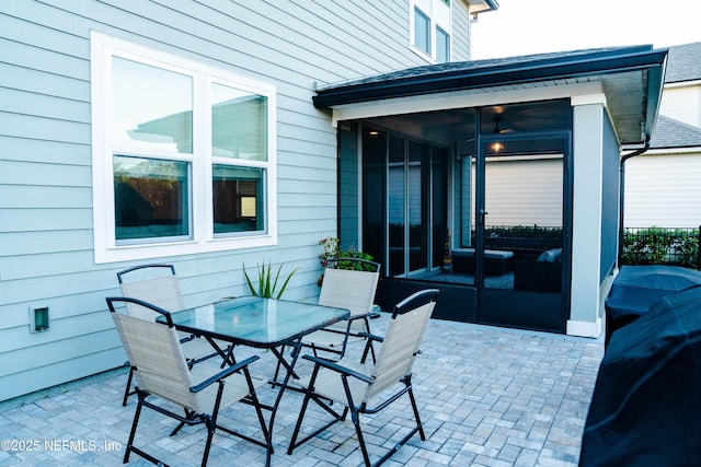 view of patio with a sunroom