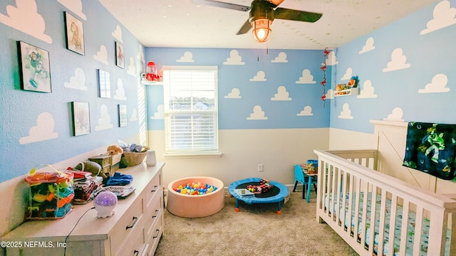 bedroom with light carpet and ceiling fan